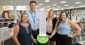 Glen Ellyn Library Foundation President Joli Murphy, Forest Glen Principal Scott Klespitz, Forest Glen Digital Literacy Specialist Marcie Callicoat, and Glen Ellyn Public Library School Liaison Alexa Moffat