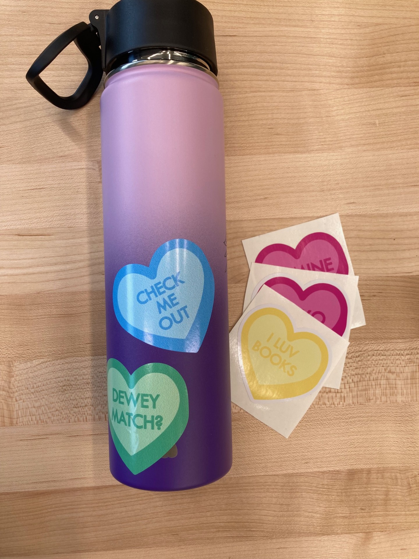 water bottle with heart-shaped stickers