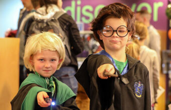 two kids dressed up as wizards for Haunted Library 2024