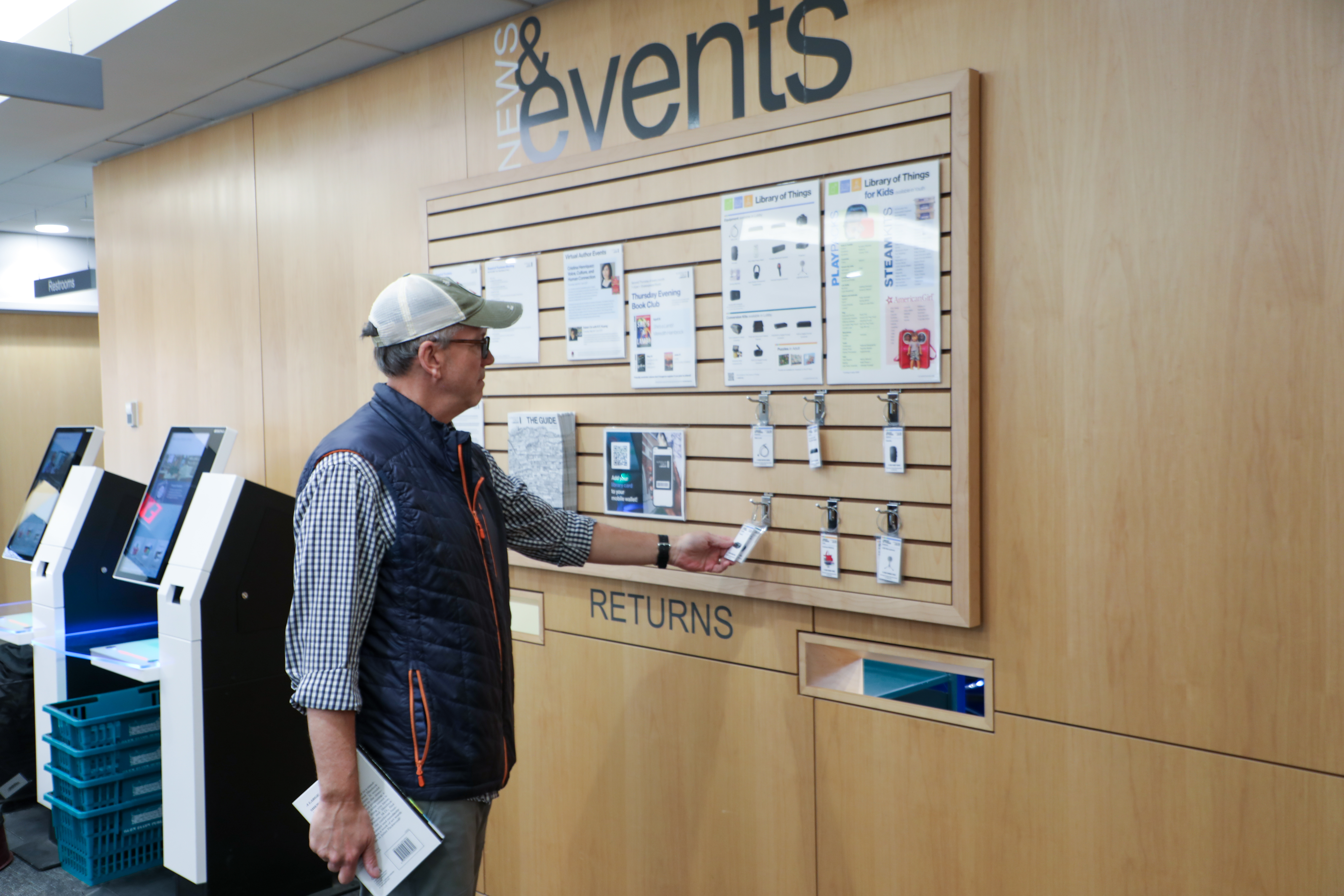 Cardholder browsing the Library of Things